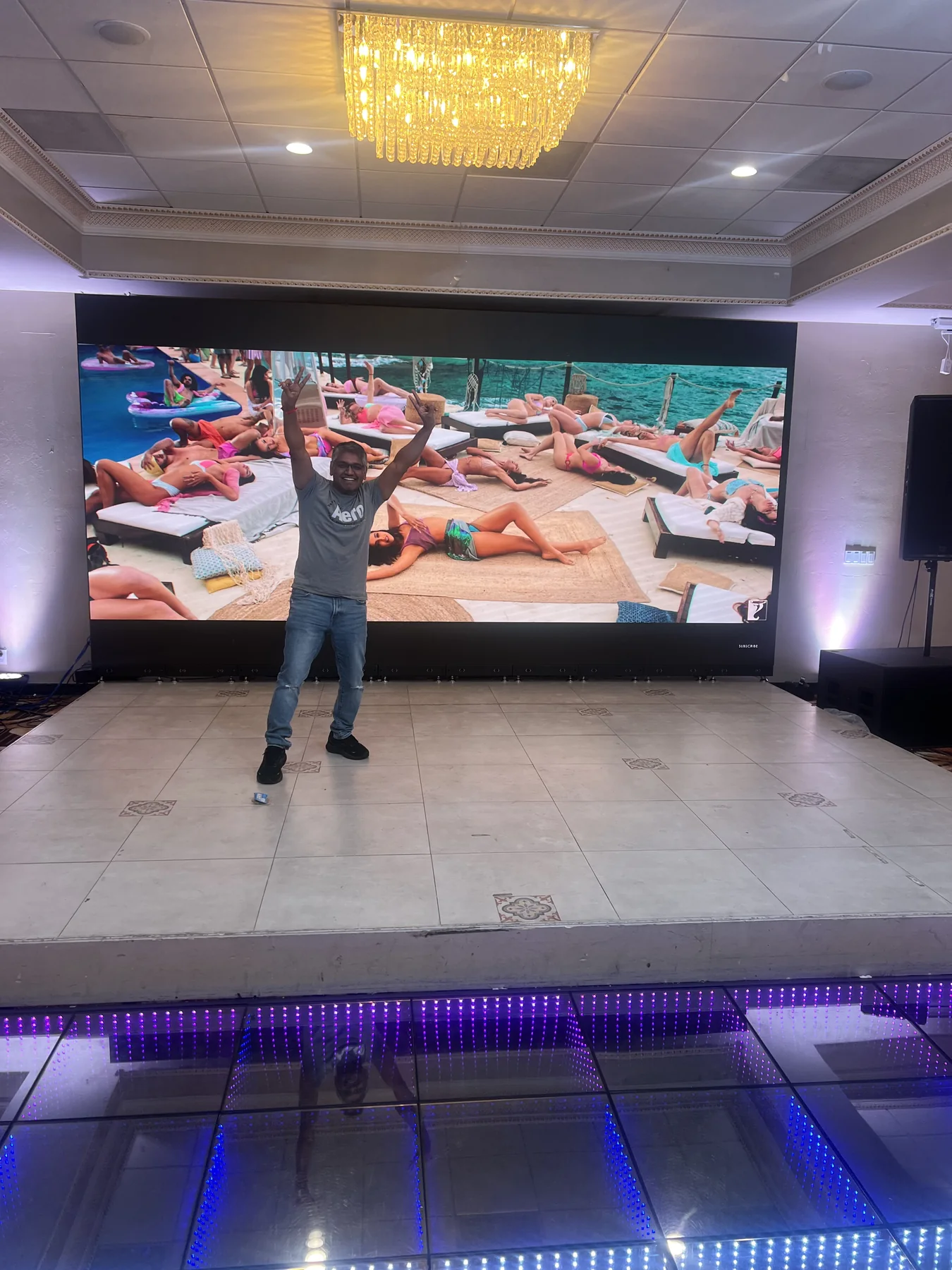 Presenter using the venue’s large LED display
